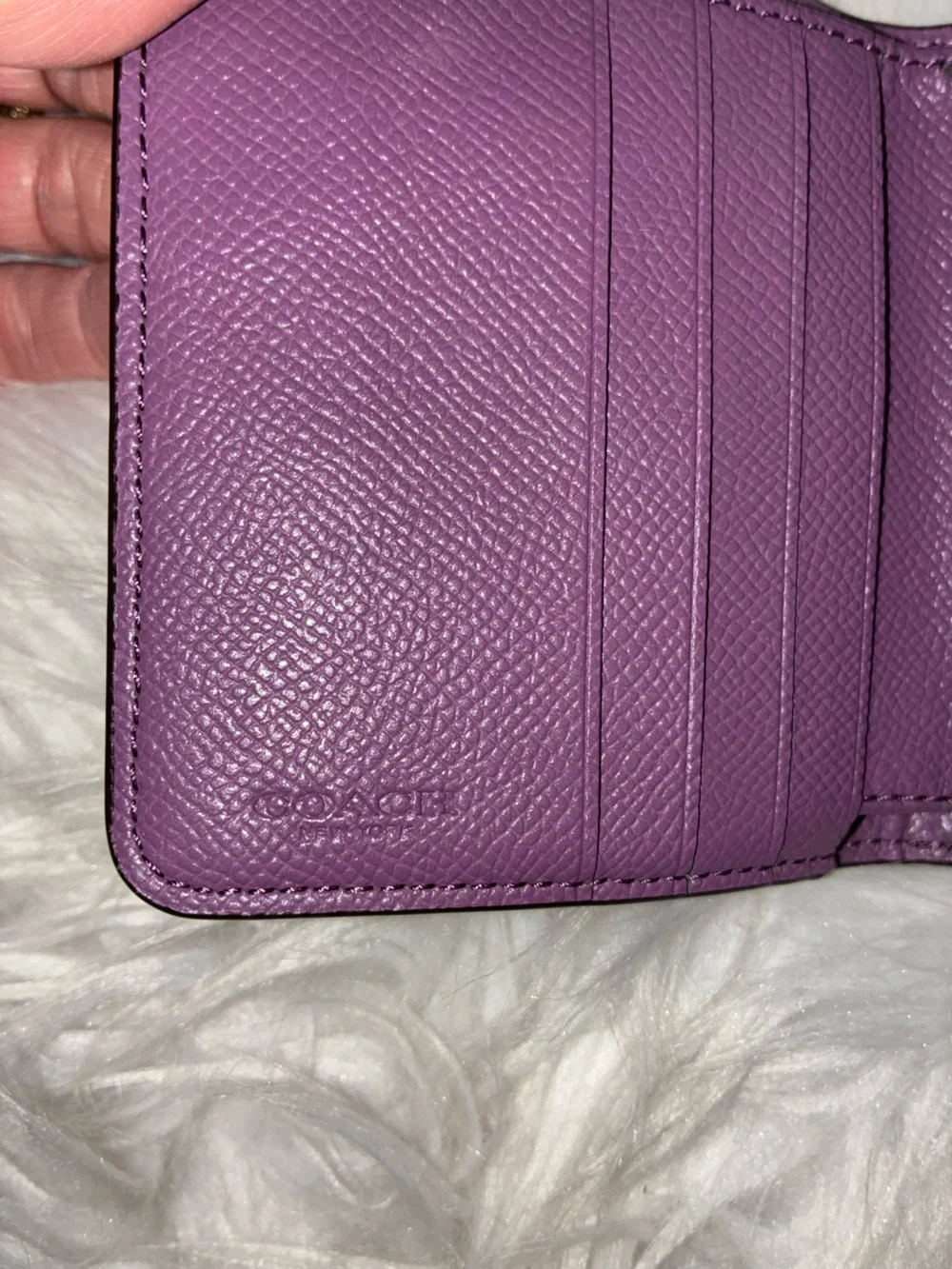 Coach Compact Trifold Pebbled Leather Wallet button closure in Plum/Purple.
